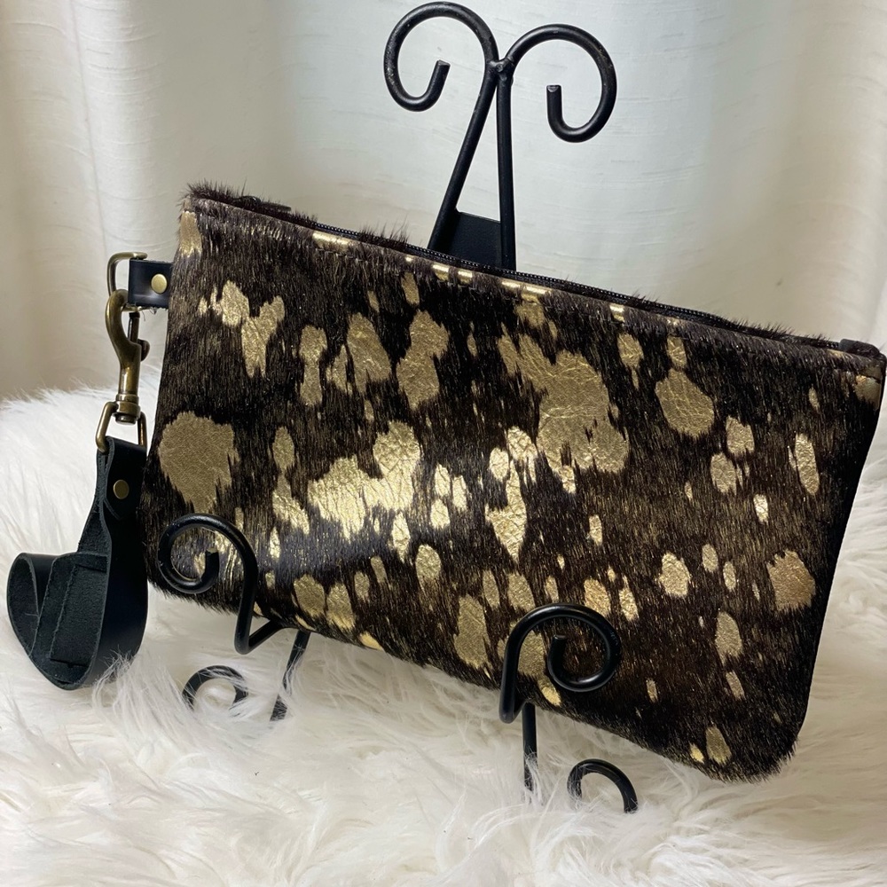 Chocolate brown with gold metallic flecks our one-of-a-kind acid wash wristlet.
